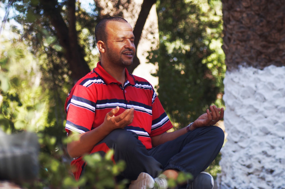 Man practising energy ritual stretching
